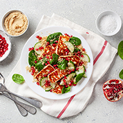 Grilled halloumi, couscous and pomegranate salad with hummus